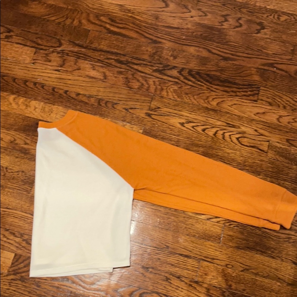 white and dark orange shirt